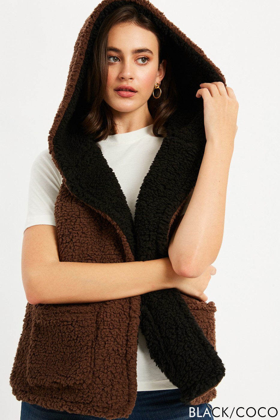 Open teddy fur vest in cocoa and black color with pockets, size small to large.
