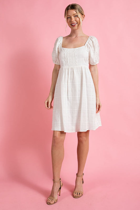 Off white mini dress with puffed sleeves and lace detail, size small to large.