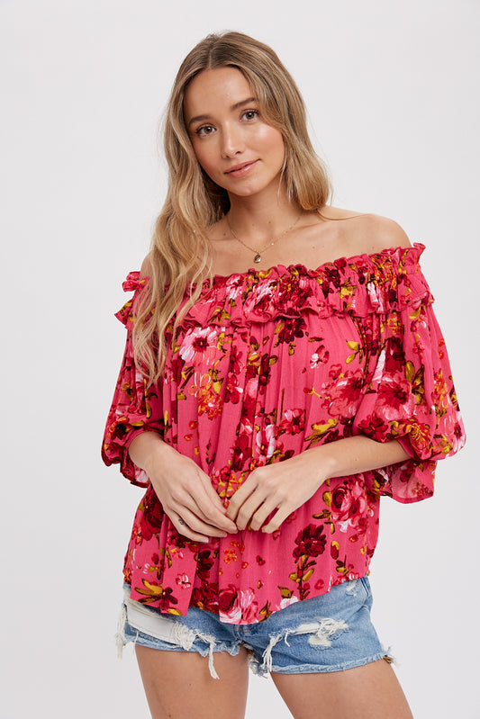 Hot pink floral blouse with elasticized ruffle neckline, size small to large.