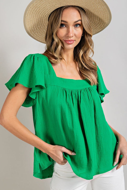 Short sleeved kelly green blouse that is woven, has ruffled sleeves and a square neckline.  Size small to large.