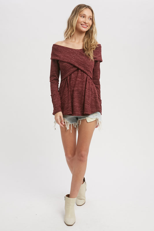 Burgundy knit top with long sleeves that cross over, size small to large.