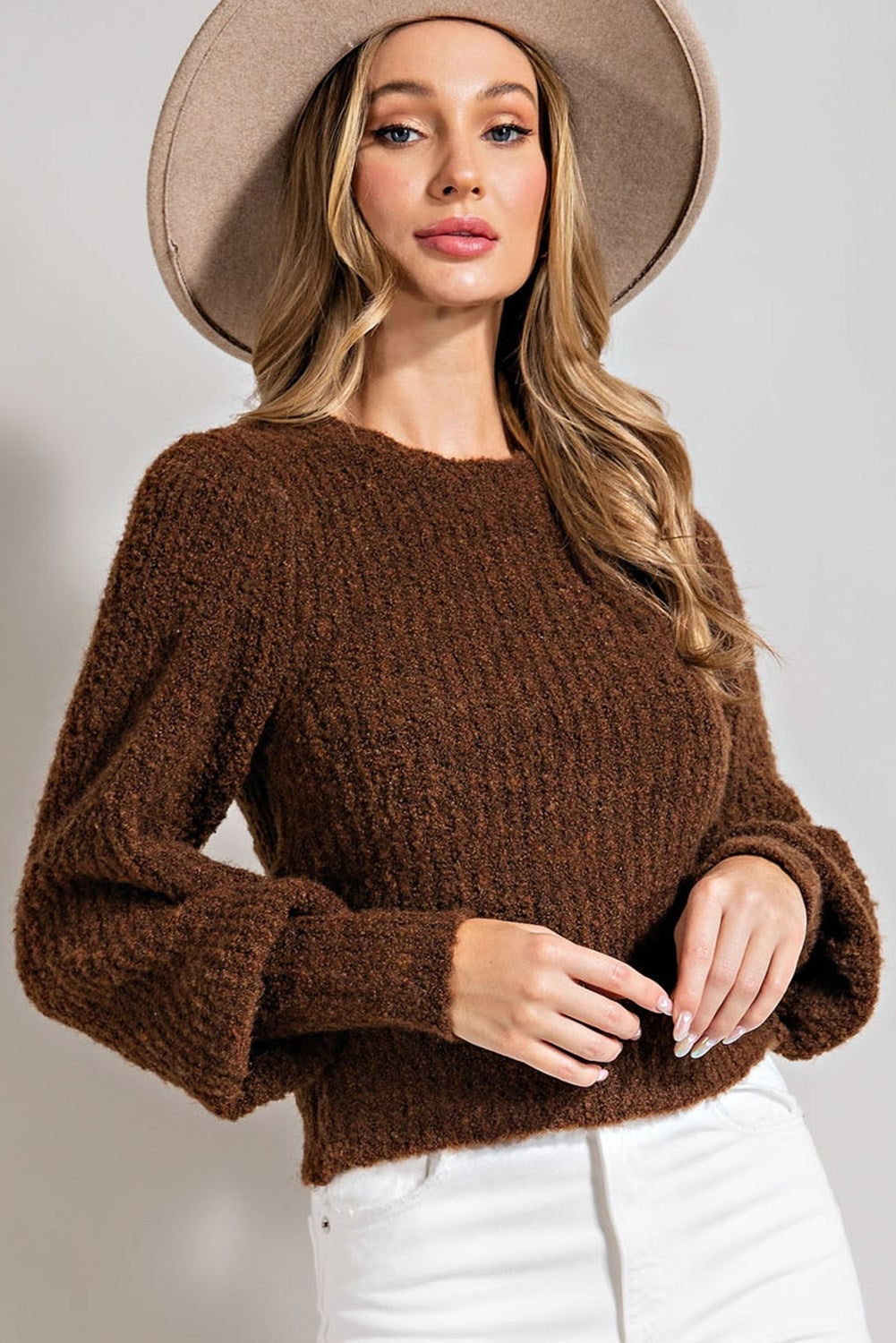 Long sleeved, fuzzy sweater in size small to large in brown.