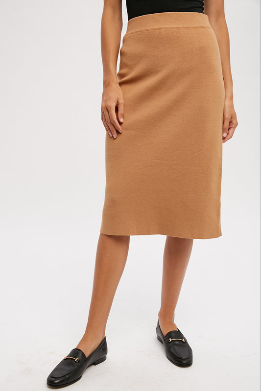 Camel colored knit skirt with slit in the back, size small to large.