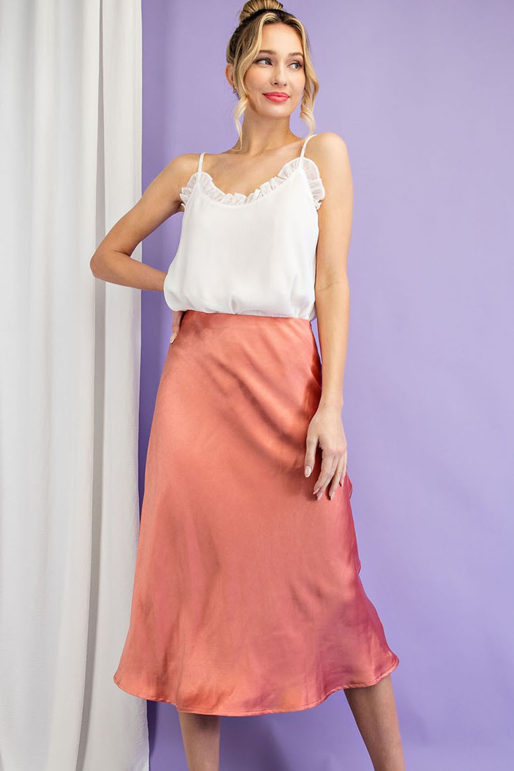 Rose gold color, midi satin skirt with a slit at the side, size small to large.