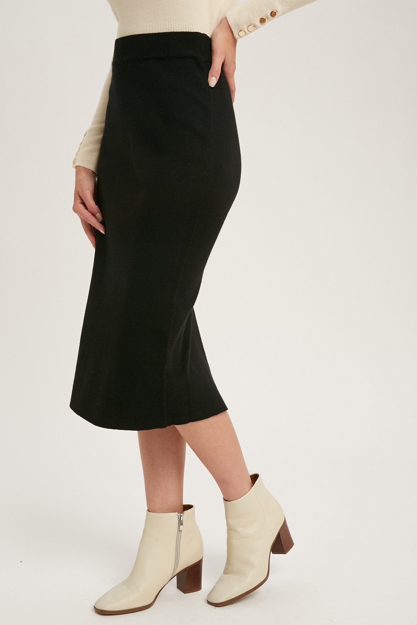 Black knit skirt with slit in the back, size small to large.